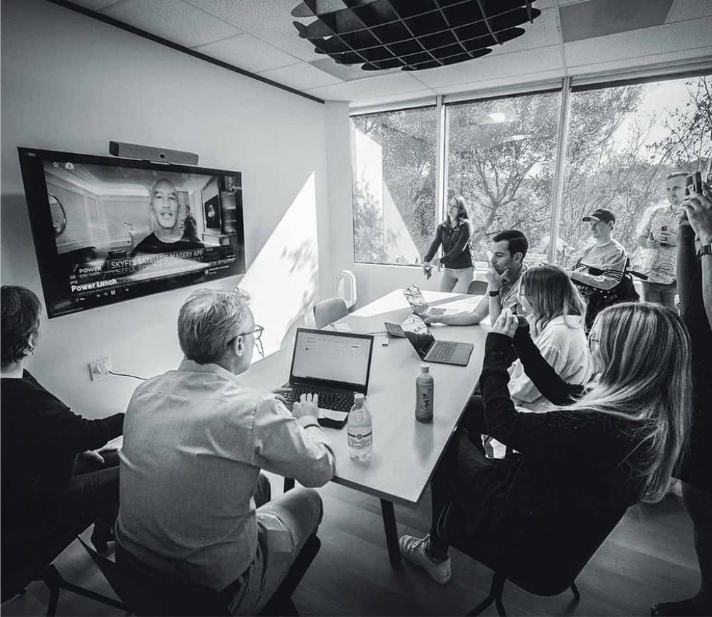 The SkyFi team collaborating in the Austin office